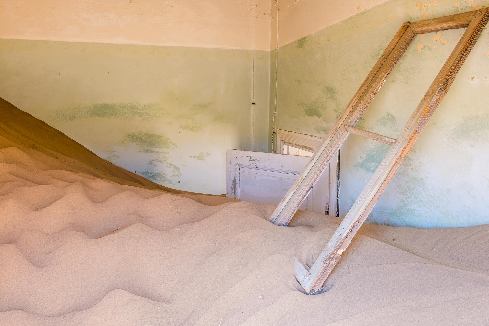 In some buildings, the sand has reached up to the top of door frames